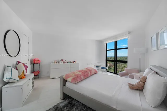 a bedroom with a bed and a closet