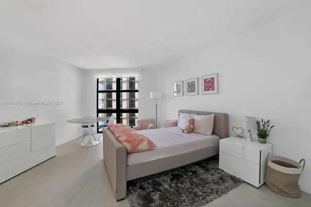 a bed room with a bed and a couch