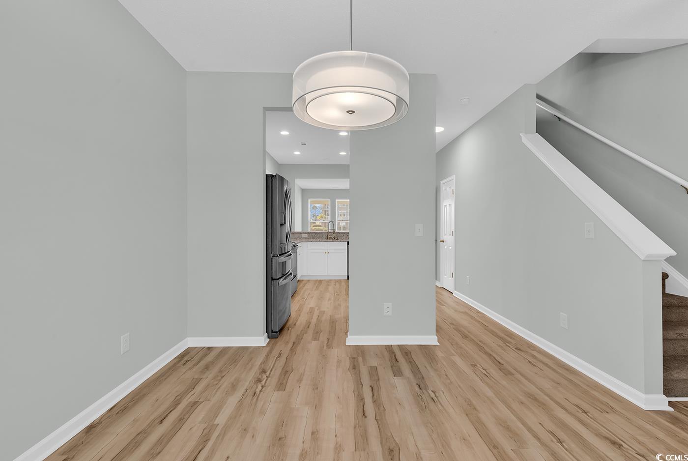308 Kiskadee Loop, Unit E Conway, SC 29526 - Photo 4 of 36 Unfurnished living room with stairway, recessed lighting, and light wood finished floors