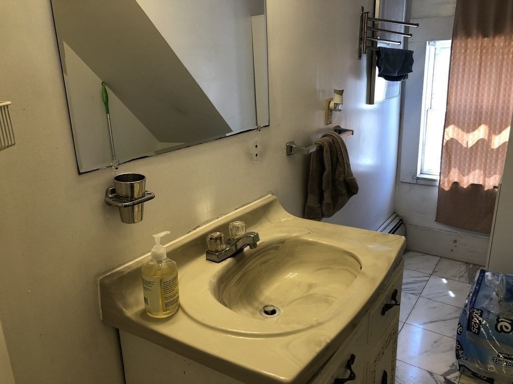 68 Boylston Street, Unit 4 Brookline, MA 02445 - Photo 12 of 12 a bathroom with a sink