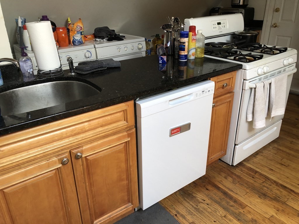 68 Boylston Street, Unit 4 Brookline, MA 02445 - Photo 3 of 12 a kitchen with a sink and wooden floor
