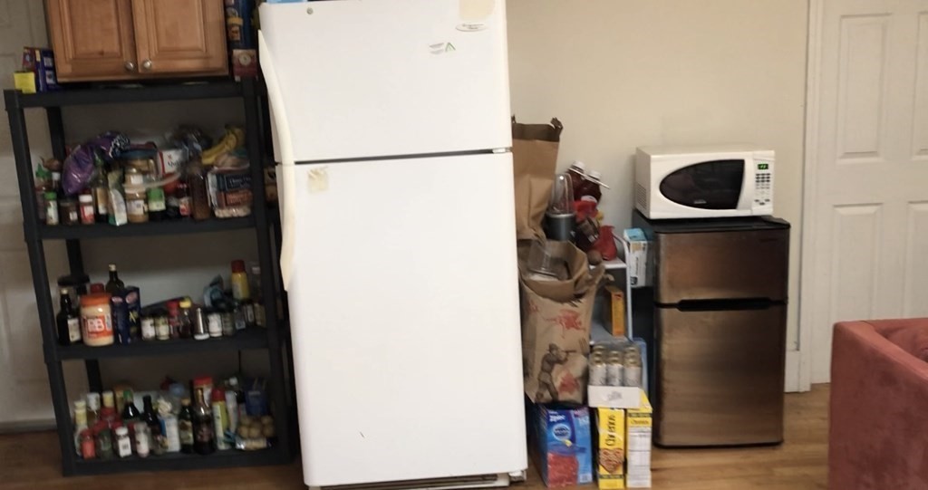 68 Boylston Street, Unit 4 Brookline, MA 02445 - Photo 5 of 12 a view of a kitchen with fridge and closet