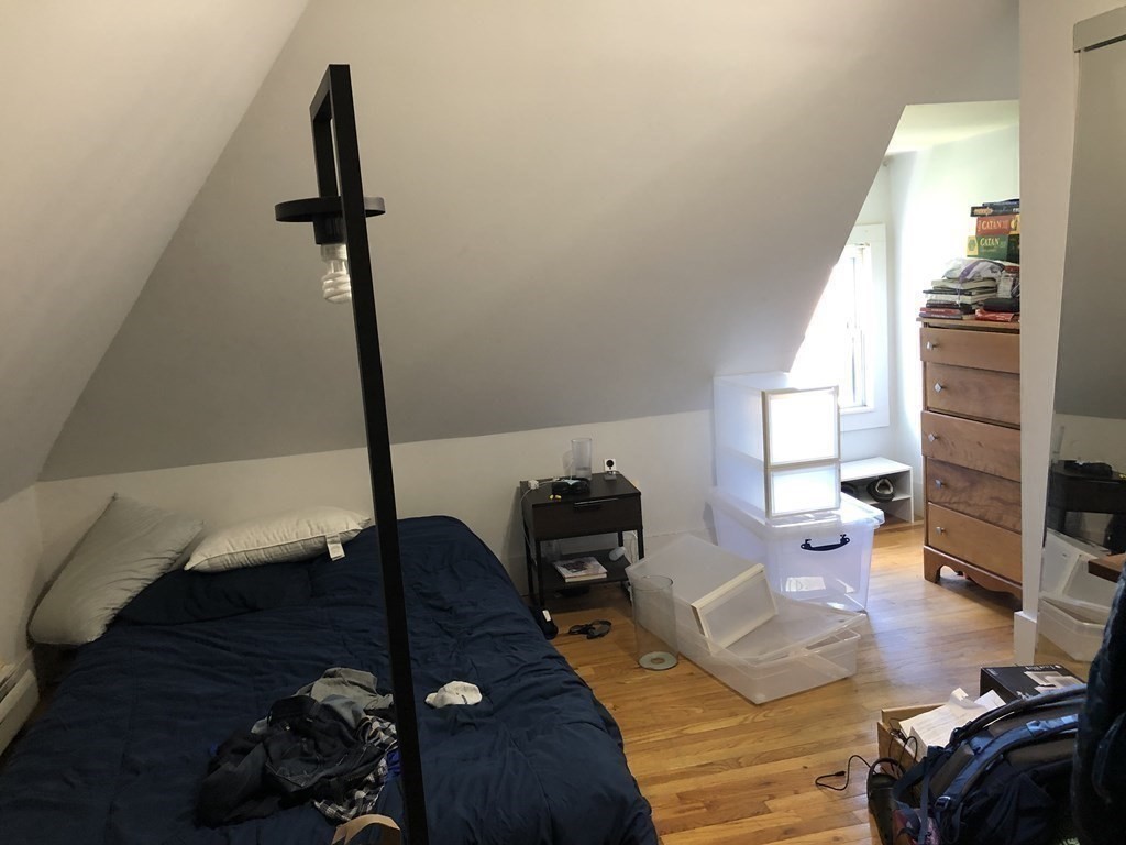68 Boylston Street, Unit 4 Brookline, MA 02445 - Photo 8 of 12 a living room with furniture and a wooden floor