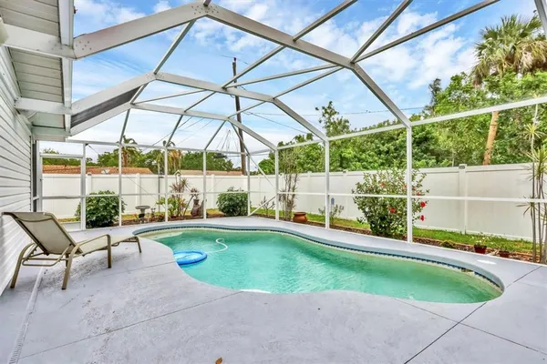 a view of a backyard with sitting area