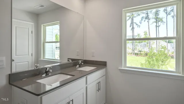 a bathroom with a shower a toilet and sink