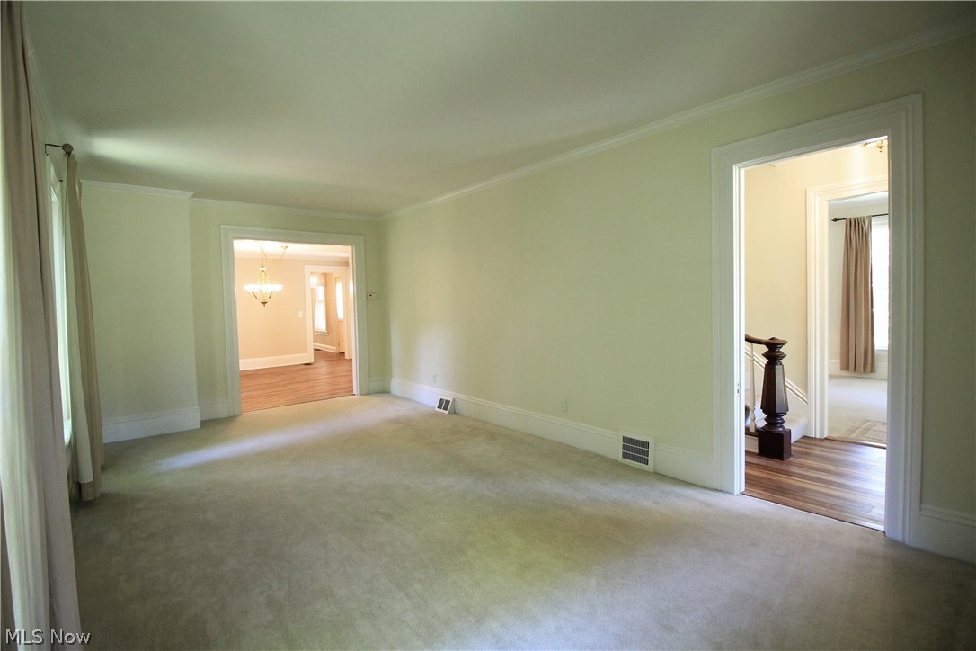 386 East Garfield Road Aurora, OH 44202 - Photo 15 of 35 Formal Living Room 23x12, carpet over tongue and grove pine planking.