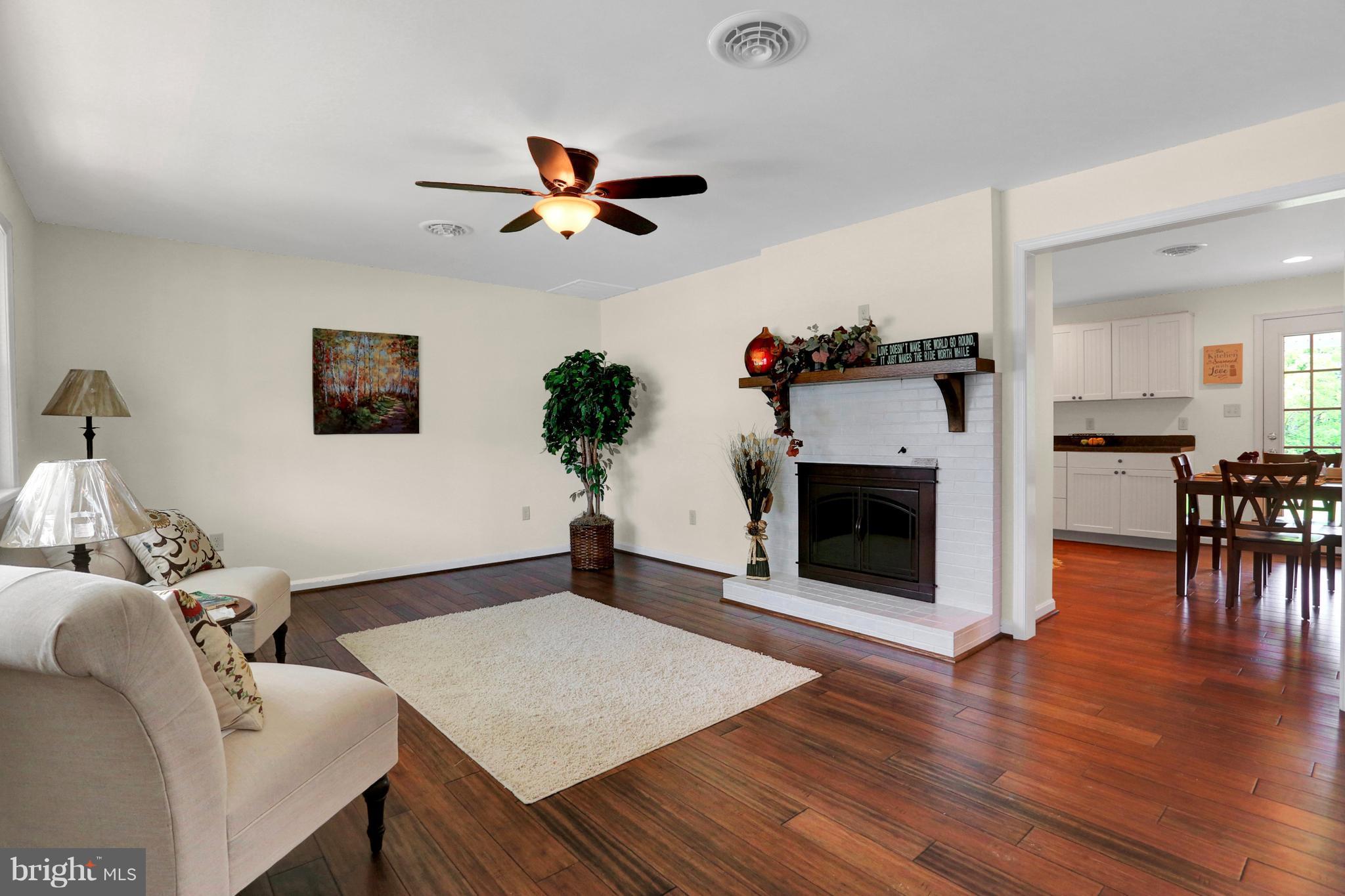 14809 Clear Spring Road Williamsport, MD 21795 - Photo 5 of 27 a living room with furniture and a fireplace