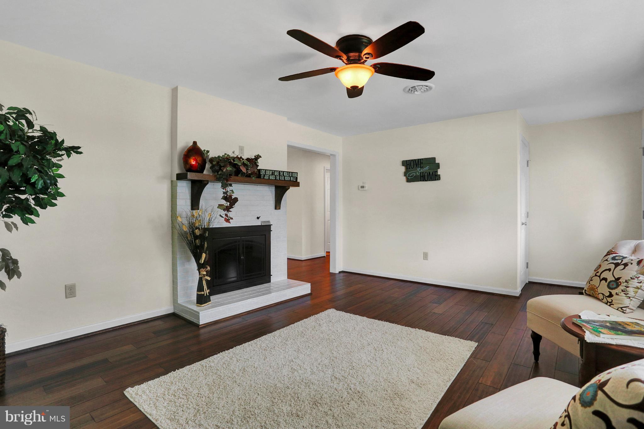 14809 Clear Spring Road Williamsport, MD 21795 - Photo 7 of 27 a living room with furniture and a fireplace