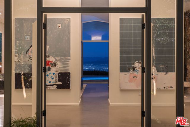 a view of hallway with a bathroom