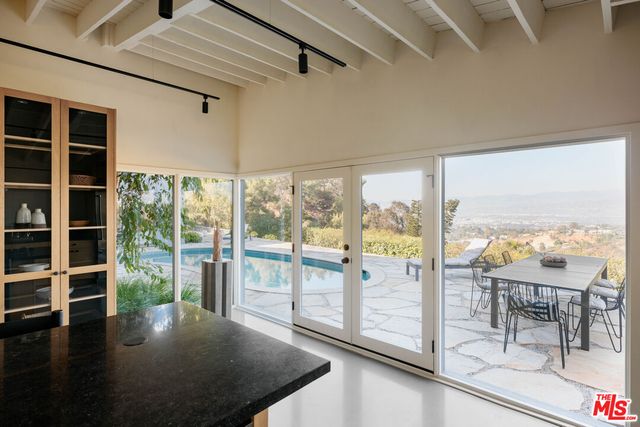 a living room with furniture and a lamp