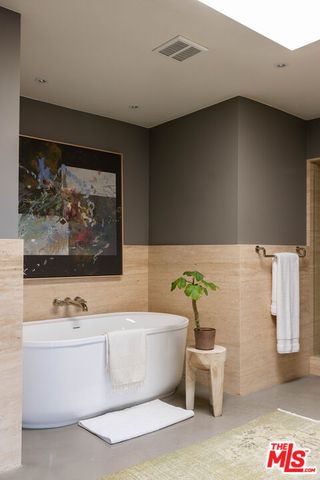 a kitchen with a refrigerator and a sink