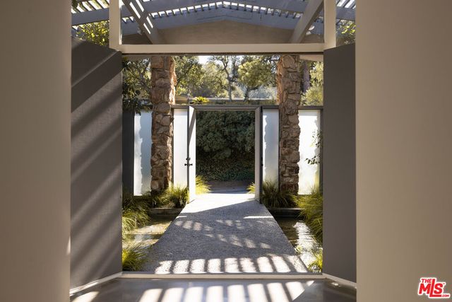 a view of a swimming pool with chairs