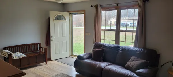 a living room with furniture and a window