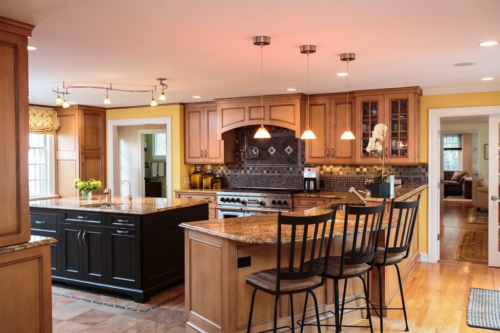 61 Hundreds Road Wellesley, MA 02481 - Photo 12 of 29 a kitchen with stainless steel appliances granite countertop a stove a sink and a refrigerator