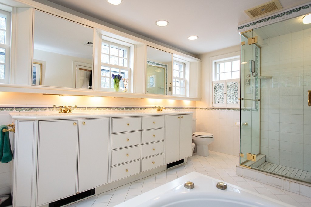 61 Hundreds Road Wellesley, MA 02481 - Photo 18 of 29 a bathroom with a granite countertop sink mirror and toilet