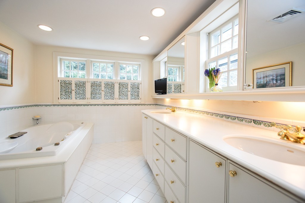 61 Hundreds Road Wellesley, MA 02481 - Photo 19 of 29 a bathroom with a tub a sink and a large window