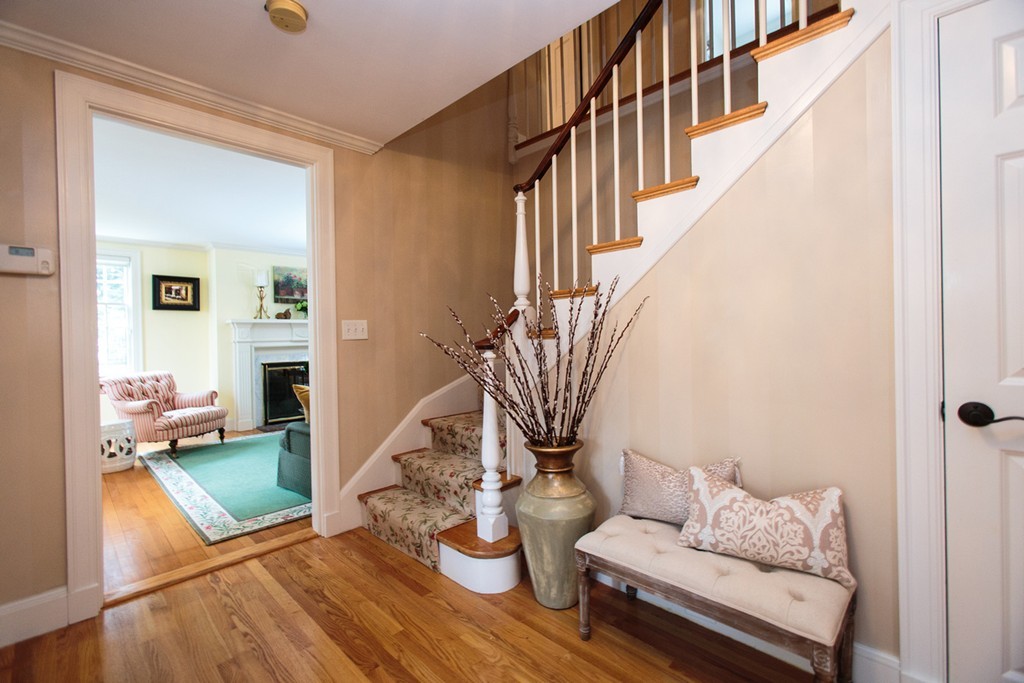 61 Hundreds Road Wellesley, MA 02481 - Photo 2 of 29 a living room with furniture and a floor to ceiling window