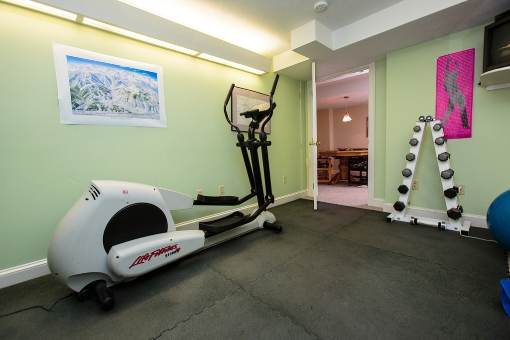 61 Hundreds Road Wellesley, MA 02481 - Photo 22 of 29 a room with gym equipment and a window