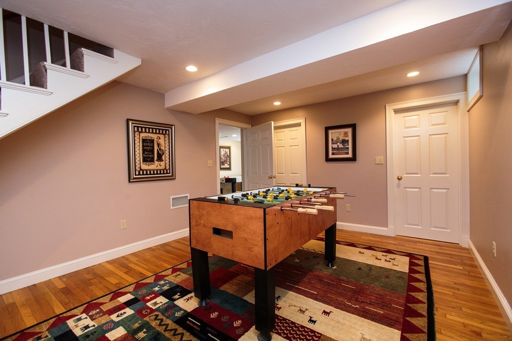 61 Hundreds Road Wellesley, MA 02481 - Photo 23 of 29 a bedroom with furniture and a rug