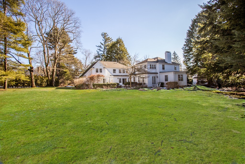 61 Hundreds Road Wellesley, MA 02481 - Photo 28 of 29 a view of a house with a big yard and large trees