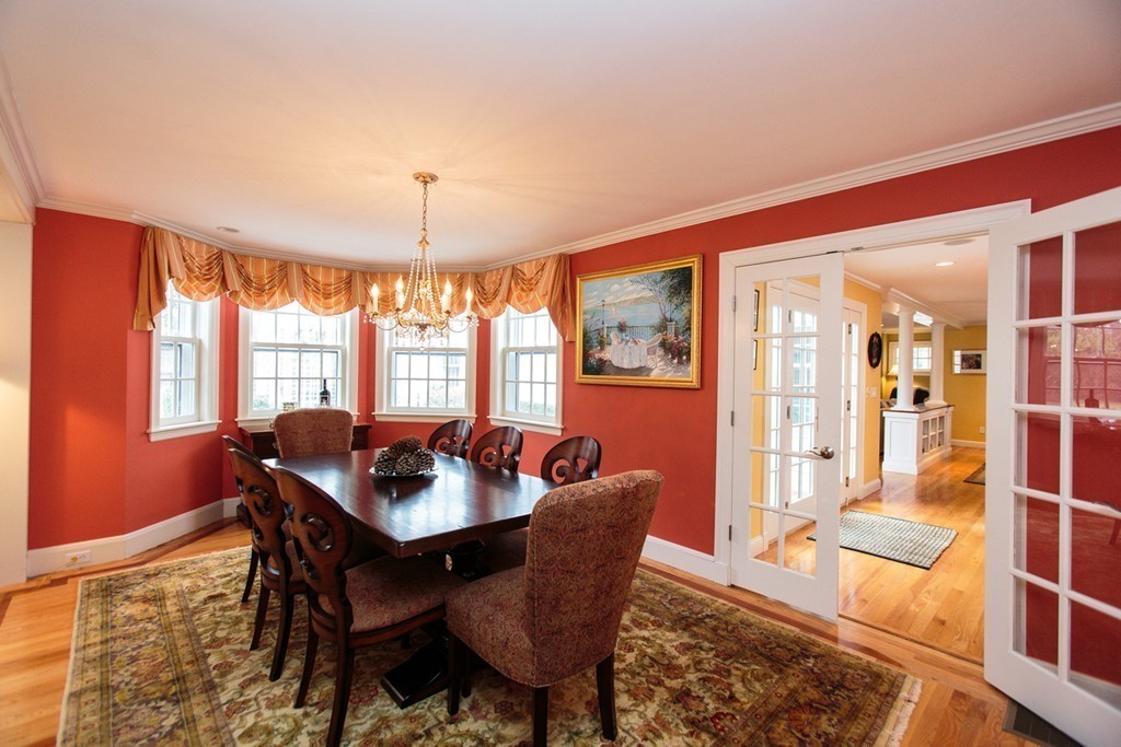 61 Hundreds Road Wellesley, MA 02481 - Photo 6 of 29 a dining room with furniture a chandelier and wooden floor