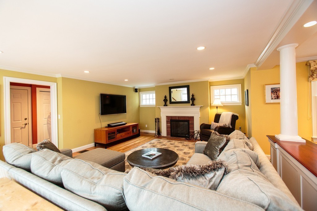 61 Hundreds Road Wellesley, MA 02481 - Photo 8 of 29 a living room with furniture fireplace and a flat screen tv