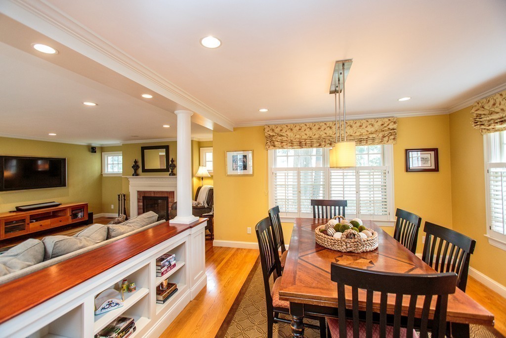 61 Hundreds Road Wellesley, MA 02481 - Photo 10 of 29 a dining room with furniture a flat screen tv and floor to ceiling window