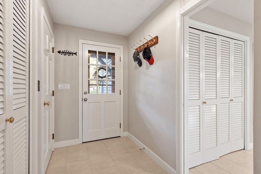 26 Bayberry Road Groton, MA 01450 - Photo 12 of 34 an entryway with wooden floor and cabinet