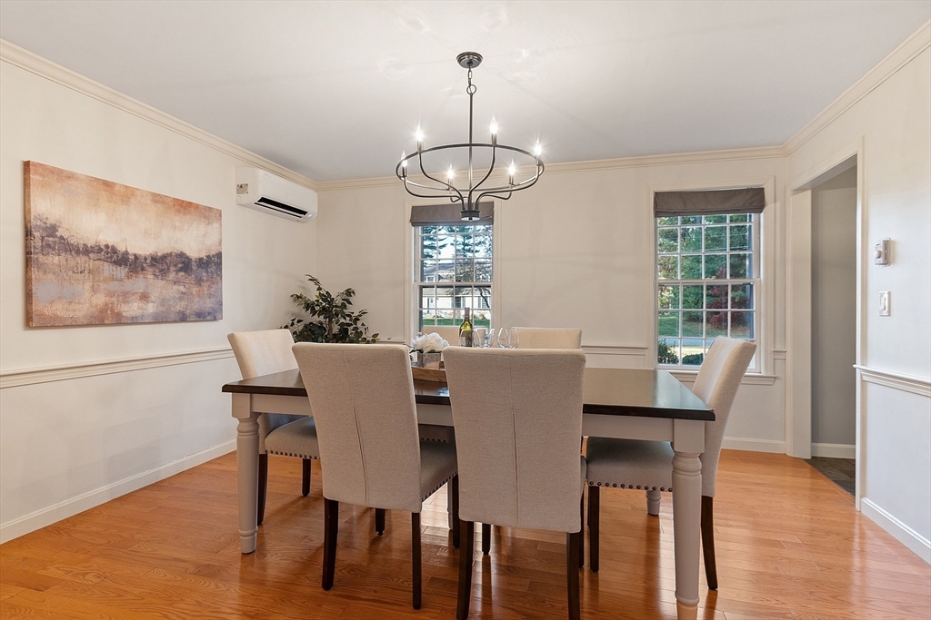 26 Bayberry Road Groton, MA 01450 - Photo 14 of 34 a view of a dining room with furniture window and wooden floor