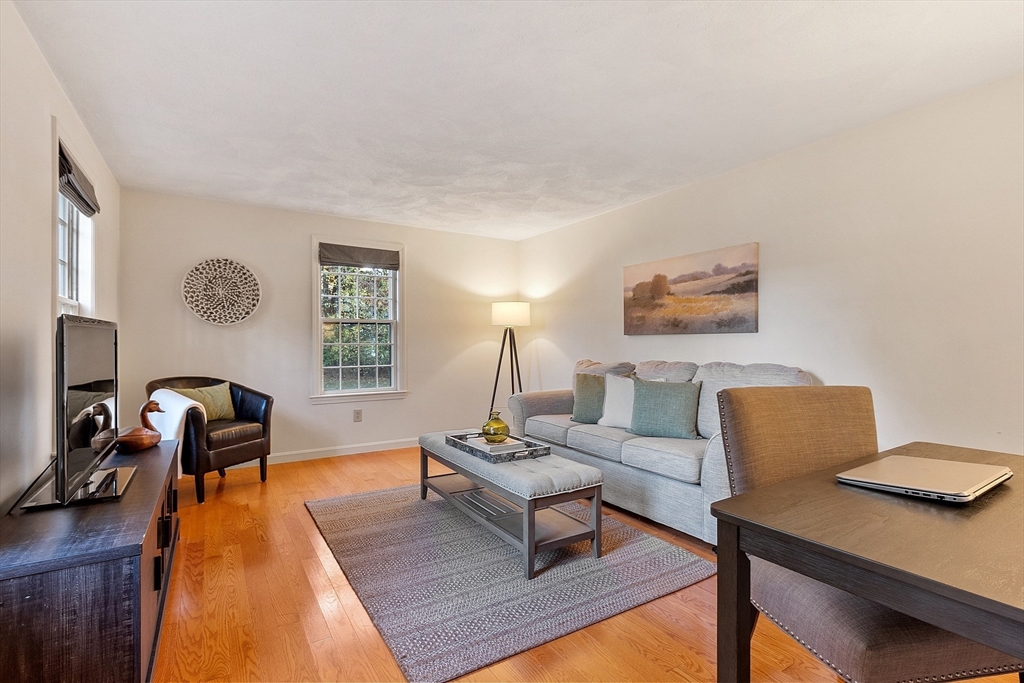 26 Bayberry Road Groton, MA 01450 - Photo 18 of 34 a living room with furniture and a table
