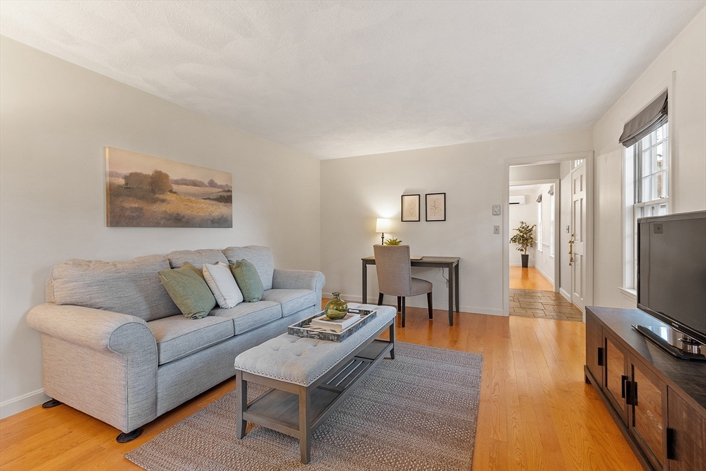 26 Bayberry Road Groton, MA 01450 - Photo 19 of 34 a living room with furniture and a flat screen tv