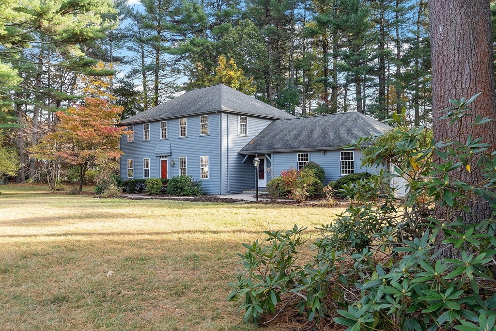 26 Bayberry Road Groton, MA 01450 - Photo 2 of 34 a front view of a house with a garden