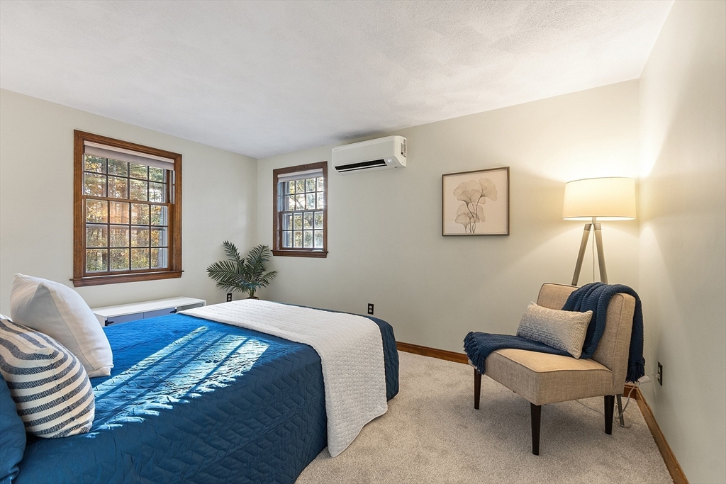 26 Bayberry Road Groton, MA 01450 - Photo 23 of 34 a bed room with a bed and a chair
