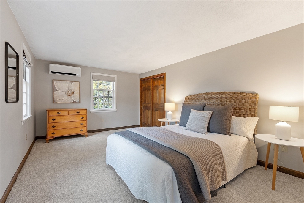 26 Bayberry Road Groton, MA 01450 - Photo 25 of 34 a bedroom with a bed a couch and window