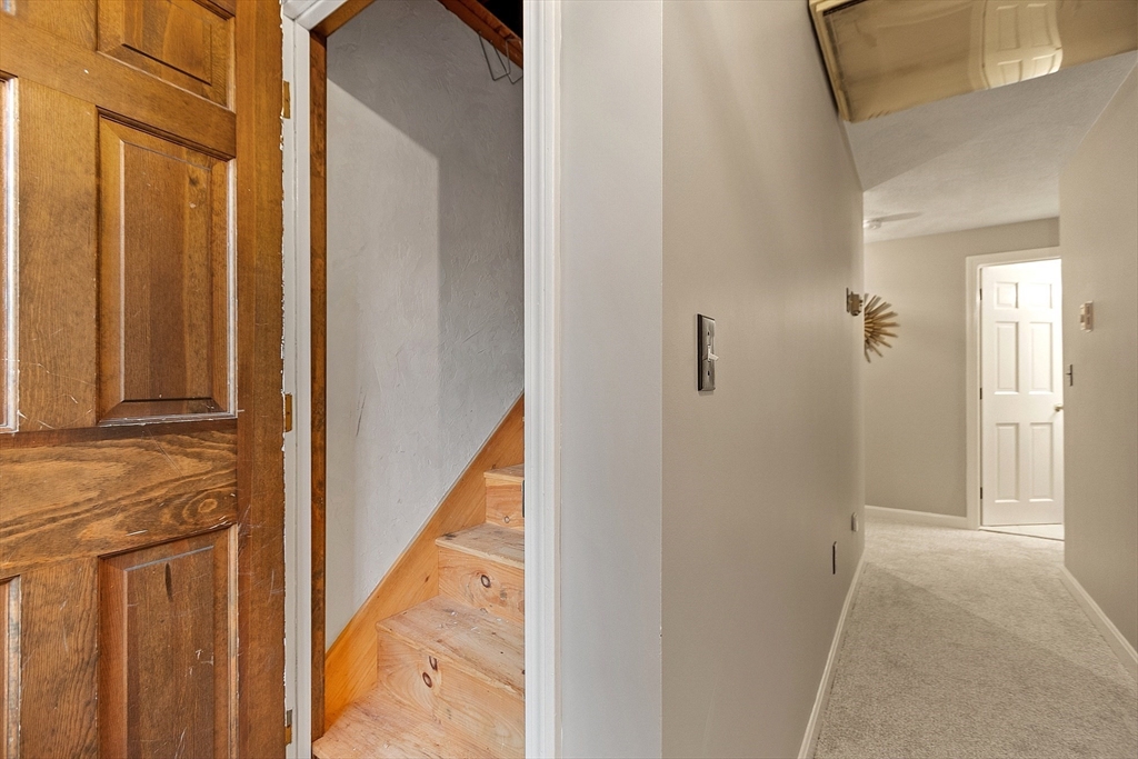 26 Bayberry Road Groton, MA 01450 - Photo 27 of 34 a view of a hallway with wooden floor and staircase