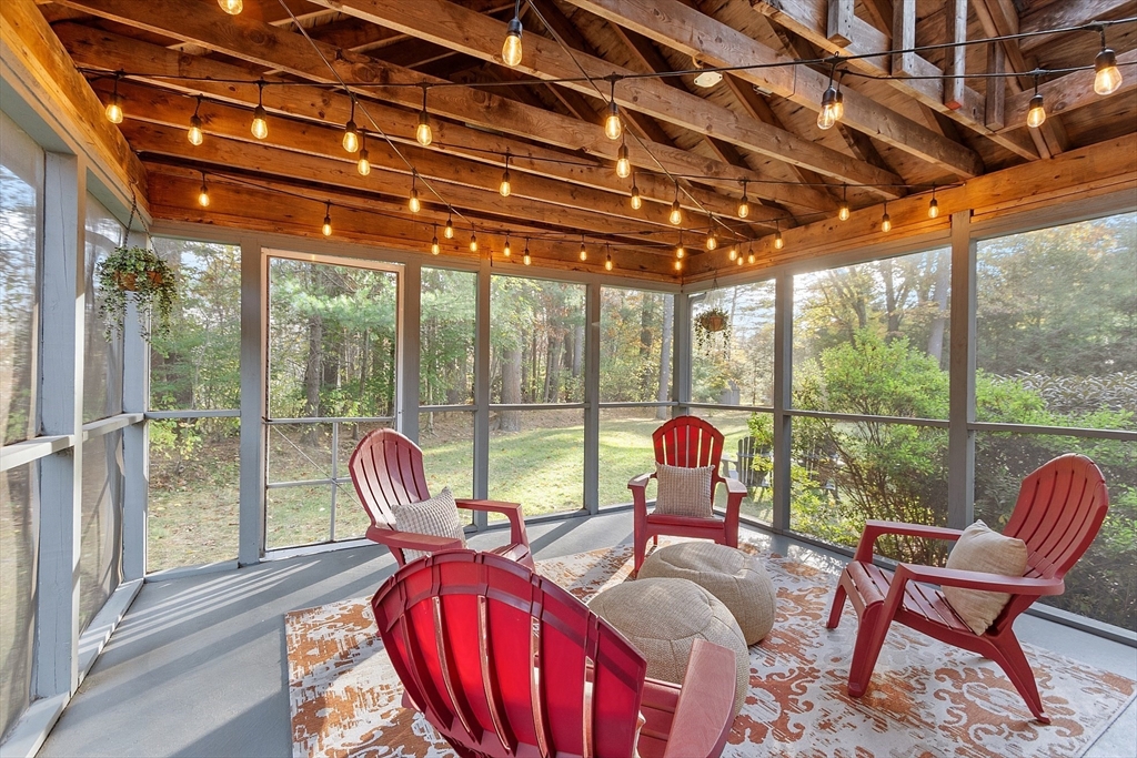 26 Bayberry Road Groton, MA 01450 - Photo 28 of 34 a living room with furniture and floor to ceiling windows