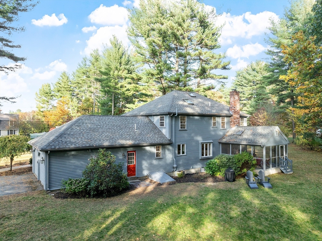 26 Bayberry Road Groton, MA 01450 - Photo 29 of 34 a front view of a house with a garden