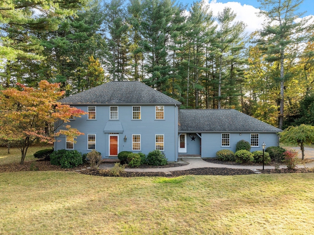 26 Bayberry Road Groton, MA 01450 - Photo 3 of 34 a front view of a house with swimming pool and porch
