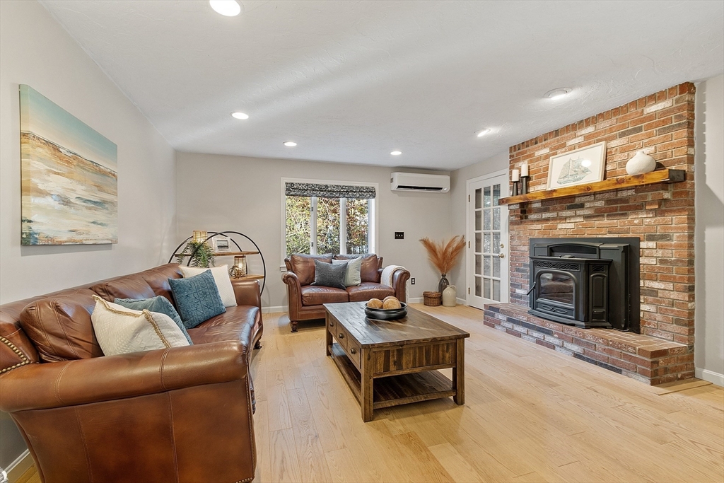 26 Bayberry Road Groton, MA 01450 - Photo 9 of 34 a living room with furniture fireplace and a flat screen tv