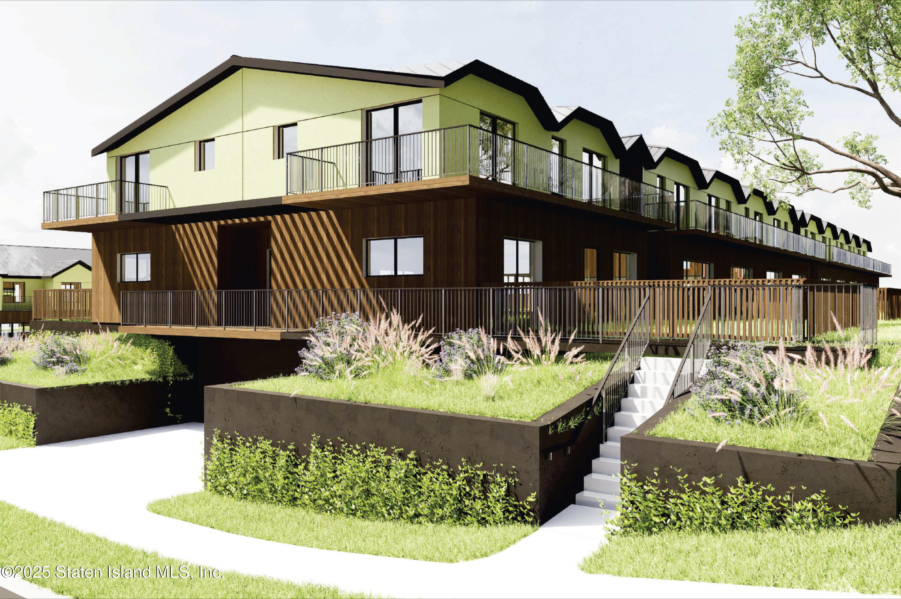 1239 Forest Hill Road, Unit 1 Staten Island, NY 10314 - Photo 1 of 3 a front view of a house with a yard