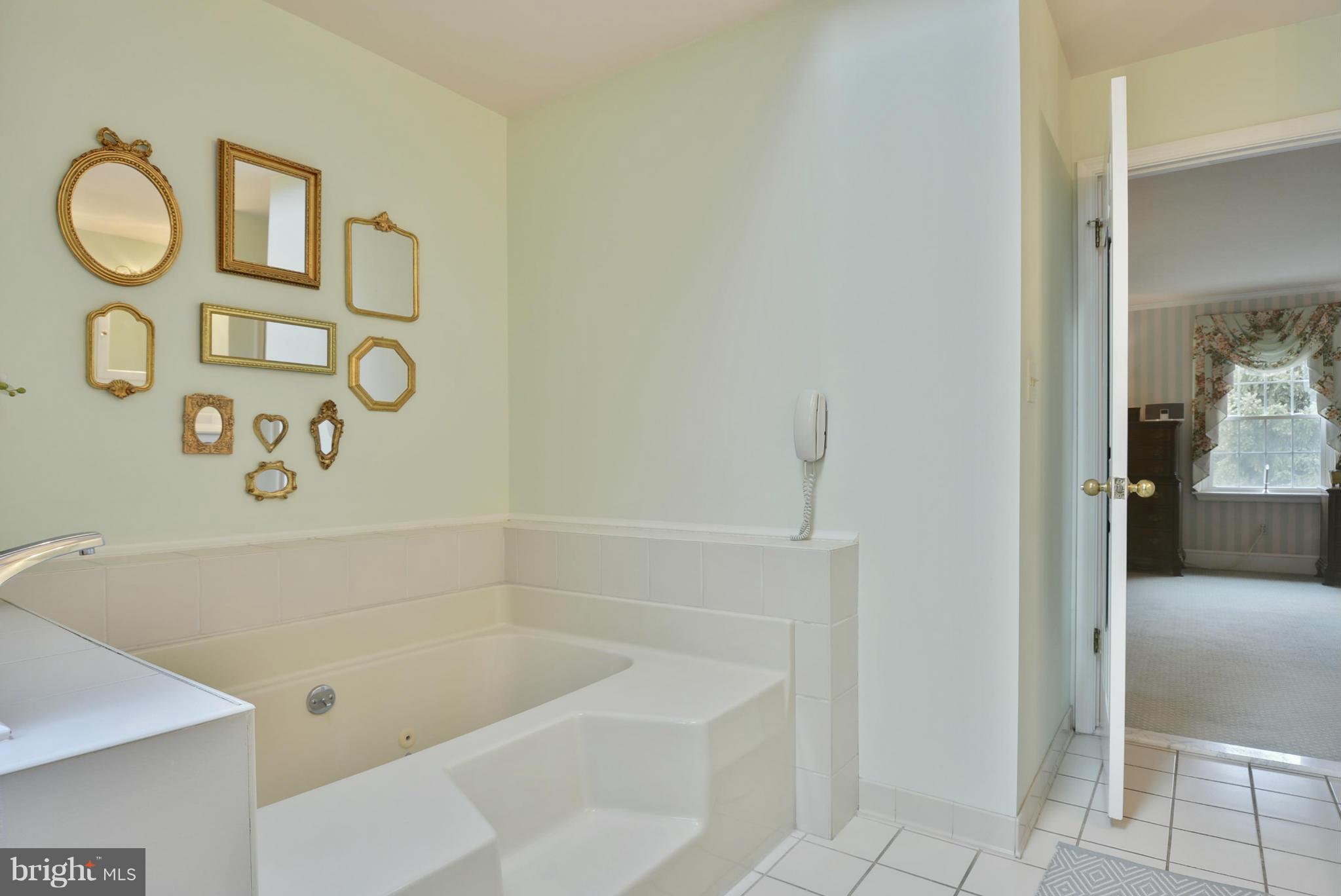 5615 Patterson Road Baldwin, MD 21013 - Photo 15 of 26 a bathroom with a bathtub and a shower