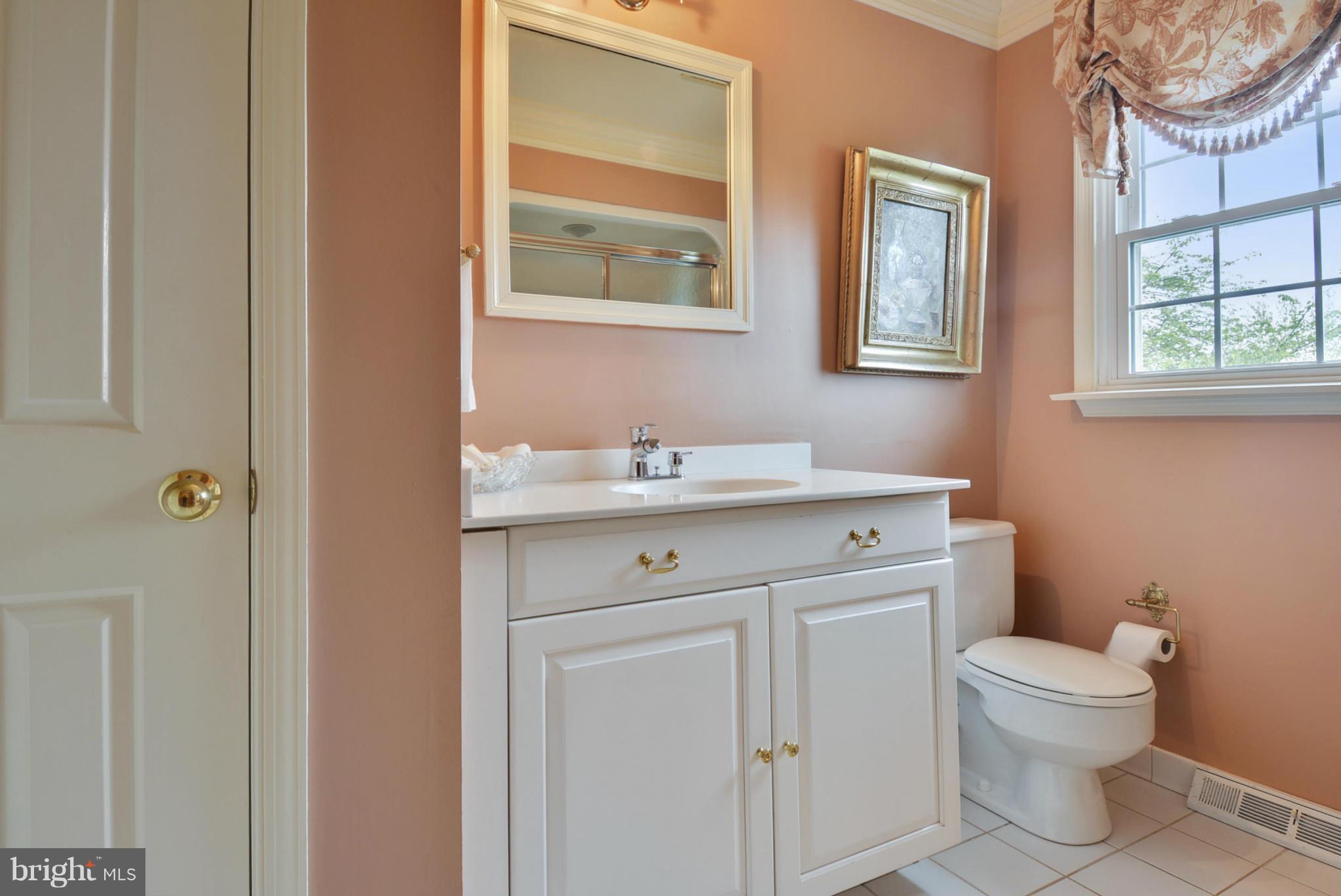 5615 Patterson Road Baldwin, MD 21013 - Photo 17 of 26 a bathroom with a toilet sink and mirror