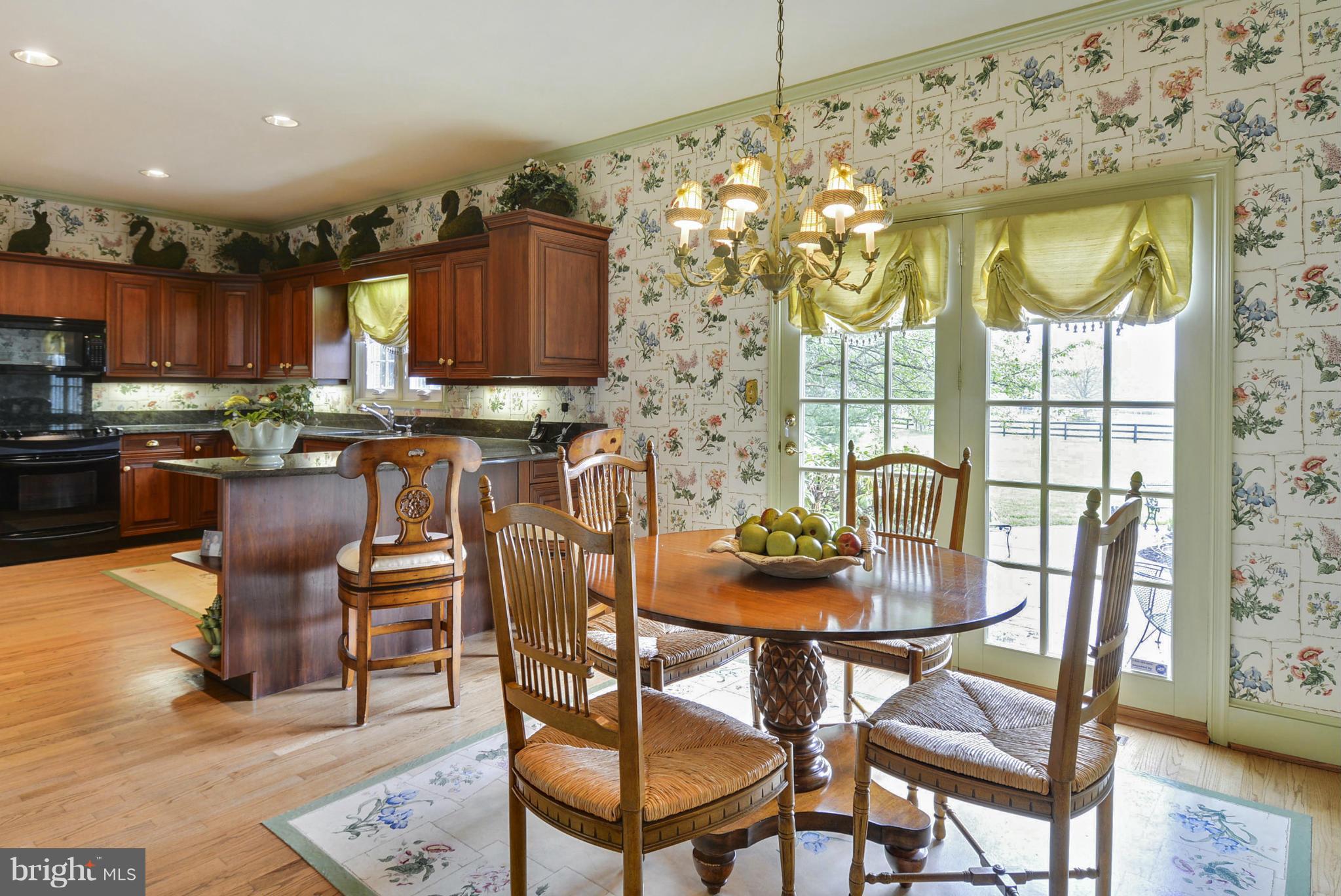 5615 Patterson Road Baldwin, MD 21013 - Photo 6 of 26 a view of a dining room with furniture and wooden floor