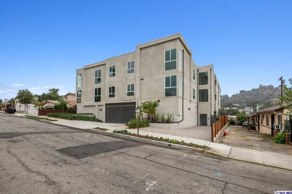a front view of a building with street view