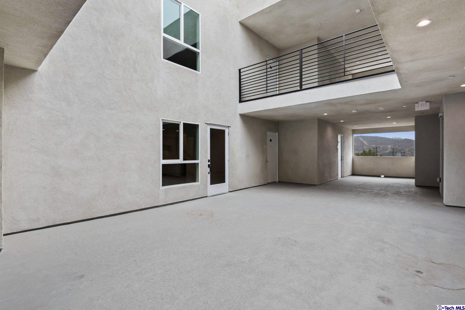 7064 Greeley Street, Unit 203 Tujunga, CA 91042 - Photo 11 of 42 an empty room with windows