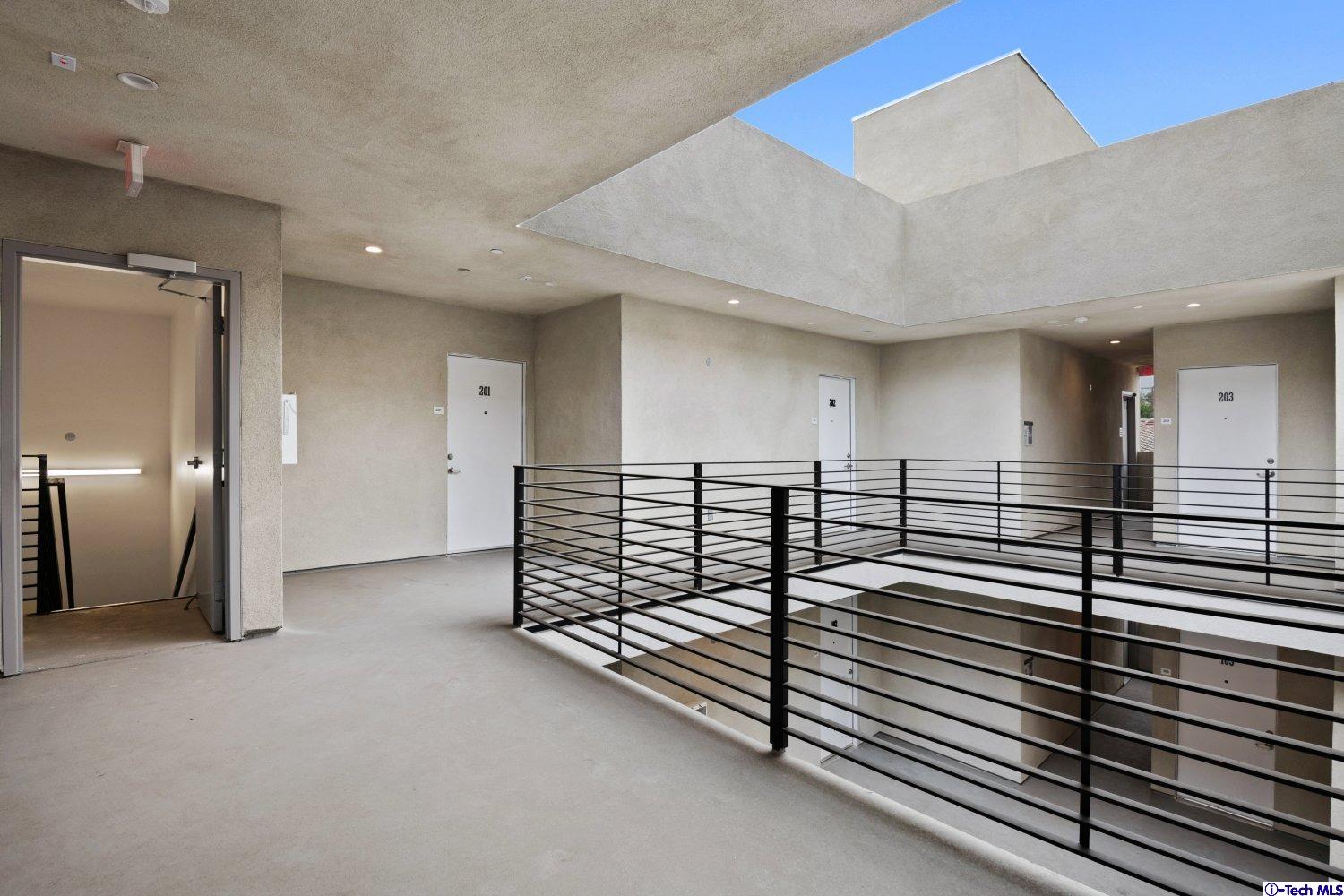 7064 Greeley Street, Unit 203 Tujunga, CA 91042 - Photo 14 of 42 a view of a hall with stairs