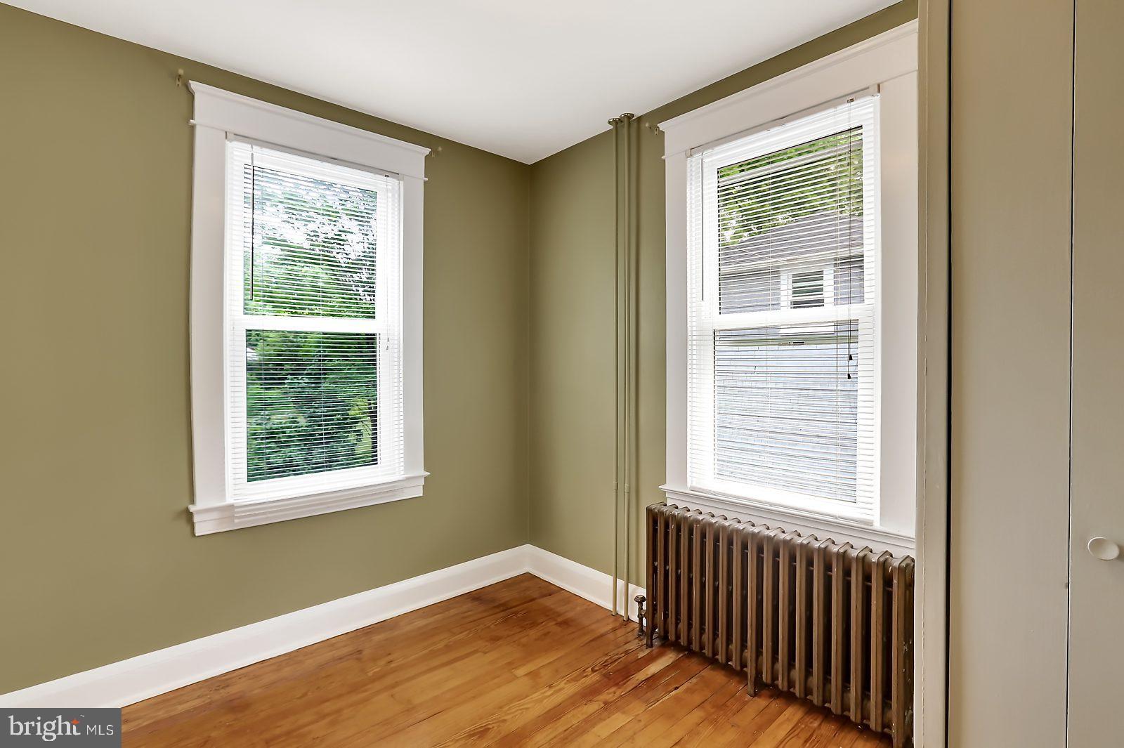 3525 St James Road Windsor Mill, MD 21244 - Photo 11 of 27 a view of an empty room with wooden floor and a window