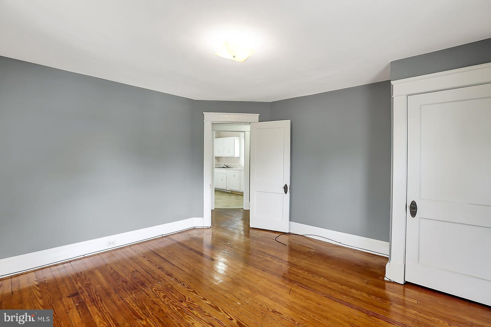 3525 St James Road Windsor Mill, MD 21244 - Photo 14 of 27 a view of an empty room with wooden floor