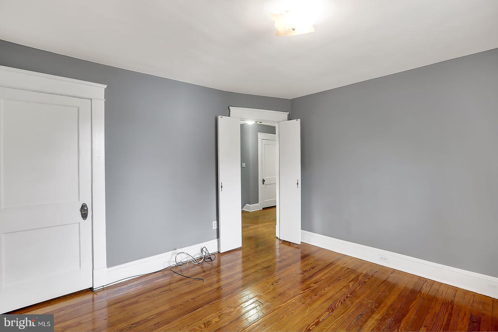 3525 St James Road Windsor Mill, MD 21244 - Photo 18 of 27 a view of an empty room with wooden floor