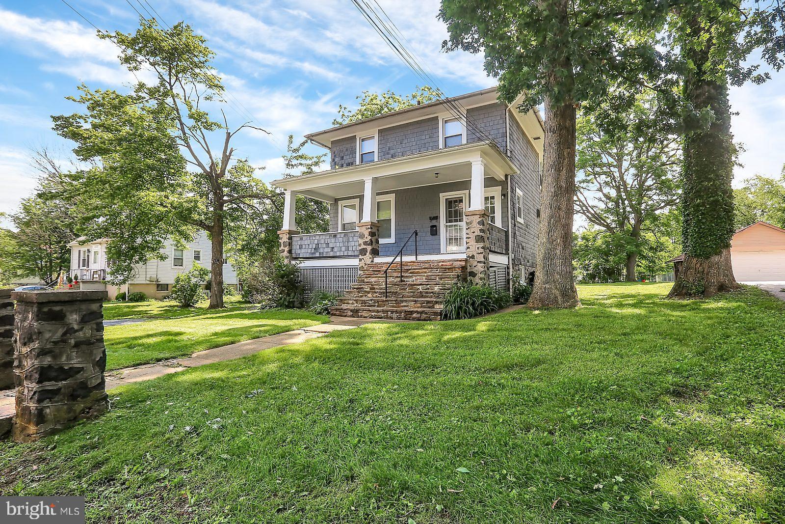 3525 St James Road Windsor Mill, MD 21244 - Photo 22 of 27 a front view of house with yard and seating area